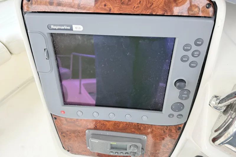 Slide: The Image of Raymarine C120 navigation display on 2004 Meridian 381 Sedan boat dashboard. - 76
