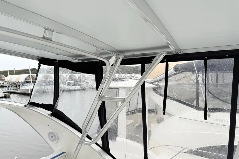 Slide: The Image of Interior view of a 2004 Meridian 381 Sedan yacht with marina backdrop. - 77