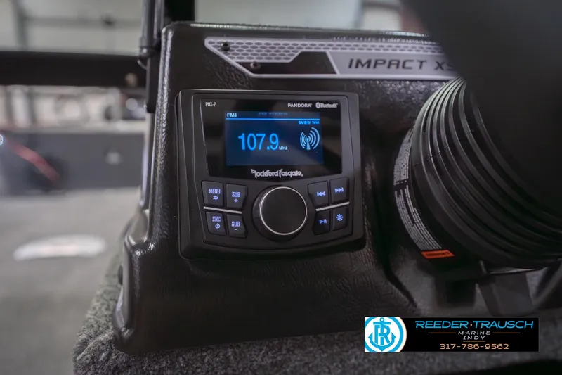 Slide: The Image of 2026 Lund 1875 Impact XS boat dashboard with Rockford Fosgate audio system display. - 35