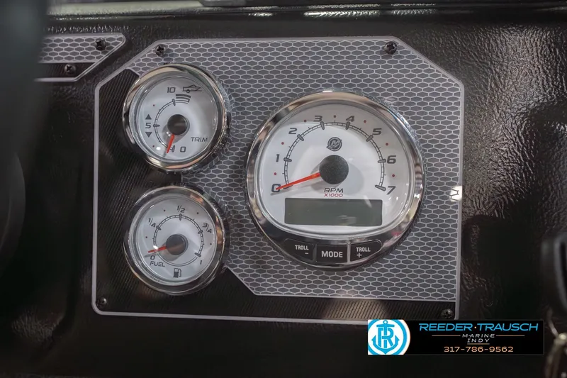 Slide: The Image of Dashboard of 2026 Lund 1875 Impact XS boat with RPM, trim, and fuel gauges. - 37