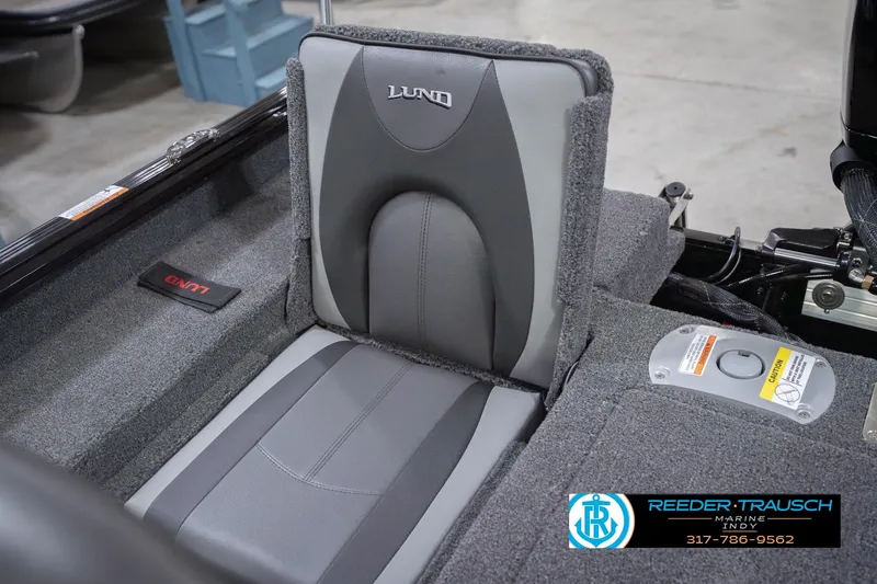 Slide: The Image of 2026 Lund 1875 Impact XS boat seat with gray upholstery and branding details. - 43