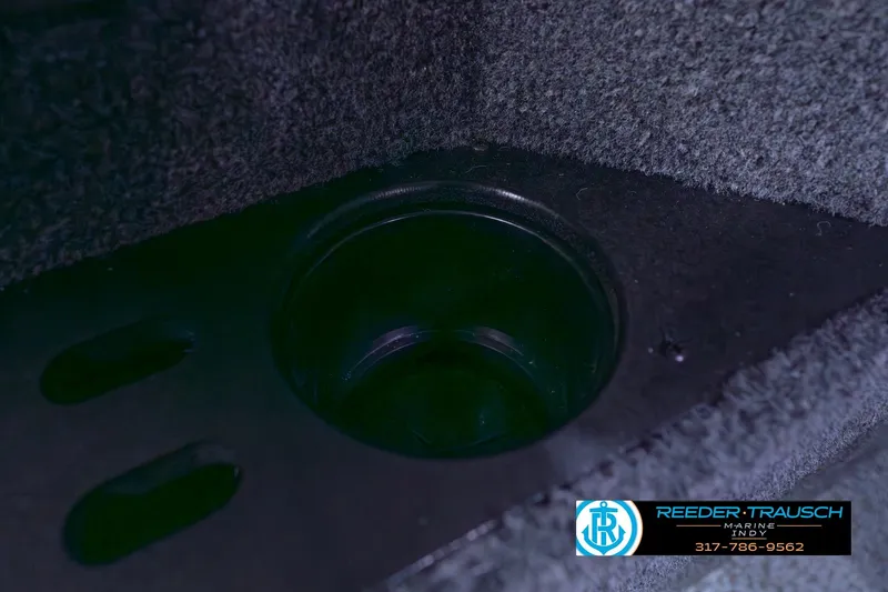 Slide: The Image of Cup holder in 2026 Lund 1875 Impact XS boat interior, Reeder-Trausch Marine logo visible. - 47