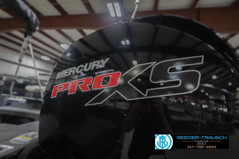 Slide: The Image of Mercury Pro XS engine on 2026 Lund 1875 Impact XS boat in showroom. - 50