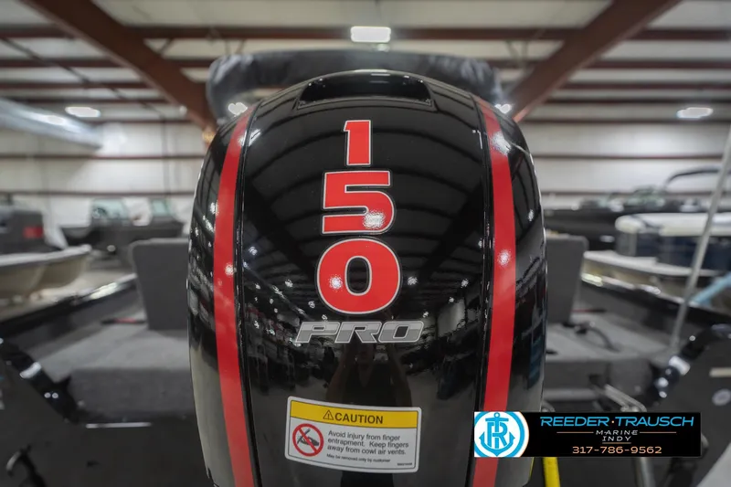 Slide: The Image of 2026 Lund 1875 Impact XS boat with 150 Pro engine in showroom. - 51