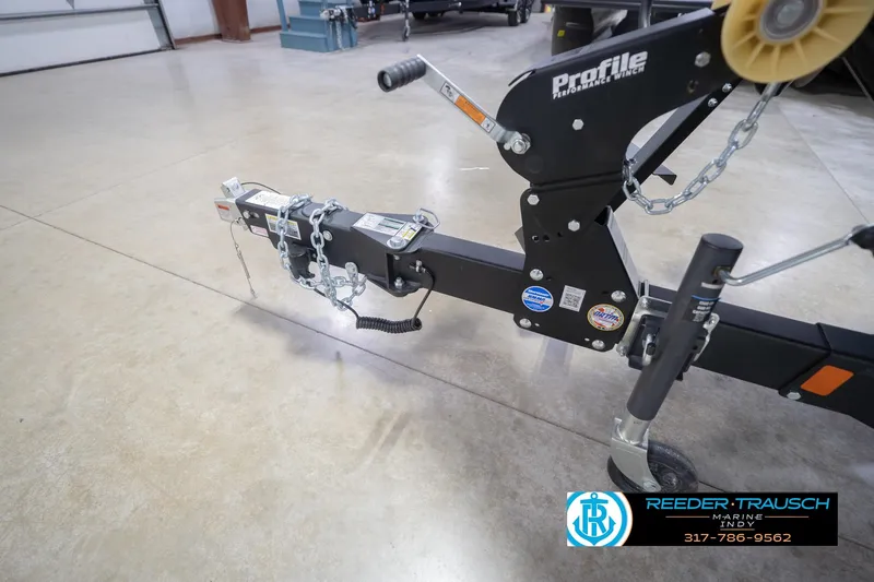 Slide: The Image of Trailer hitch of 2026 Lund 1875 Impact XS with Profile Performance Winch in a showroom. - 60