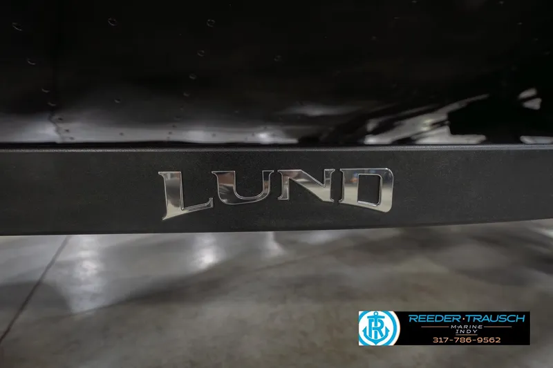 Slide: The Image of 2026 Lund 1875 Impact XS boat logo on display at Reeder Trausch Marine. - 62
