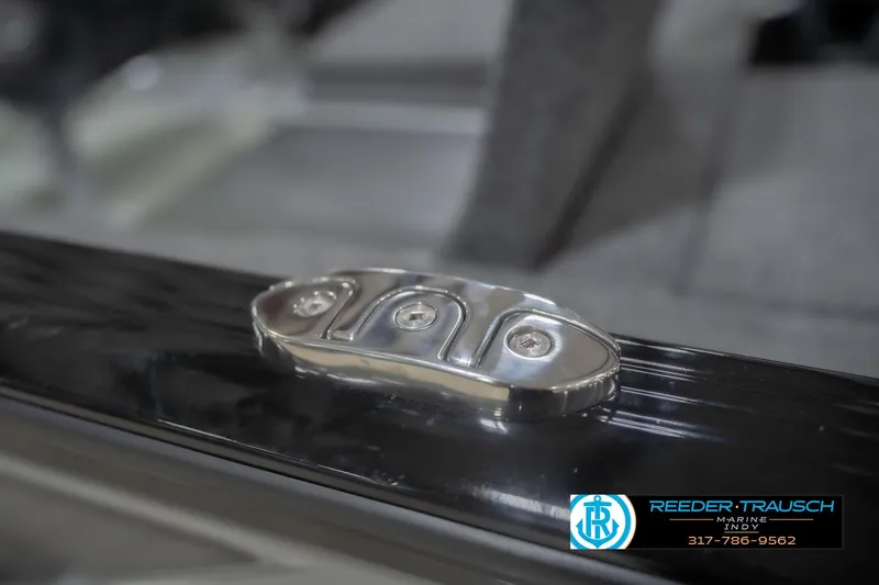 Slide: The Image of Close-up of 2026 Lund 1875 Impact XS boat detail with Reeder Trausch Marine logo. - 64