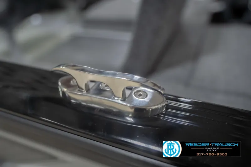 Slide: The Image of Stainless steel cleat on 2026 Lund 1875 Impact XS boat, Reeder Trausch Marine logo visible. - 65