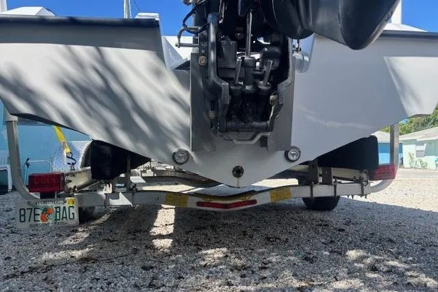 Slide: The Image of Rear view of a 1985 JJM VS boat on a trailer, showing the motor and license plate. - 8