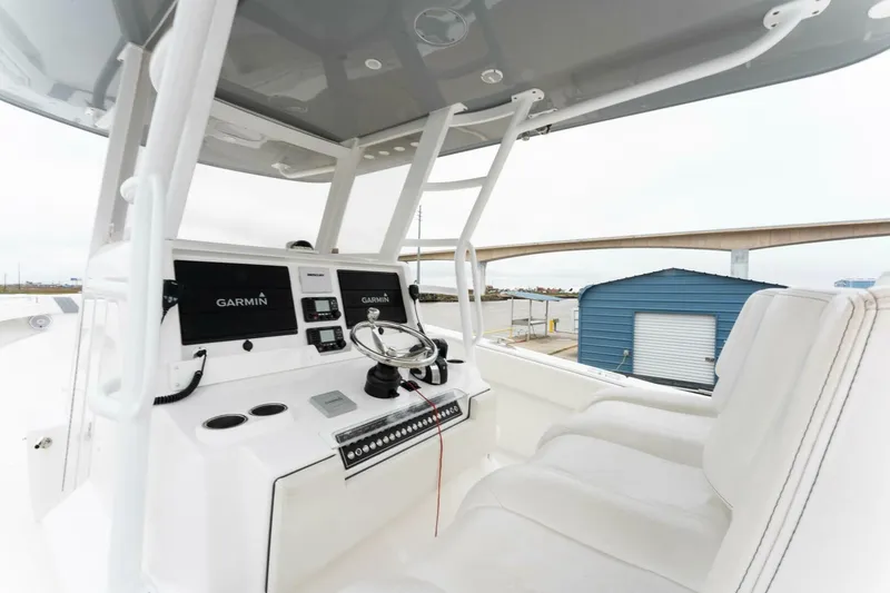 Slide: The Image of 2019 Invincible 39 Open Fisherman boat cockpit with Garmin navigation system. - 3