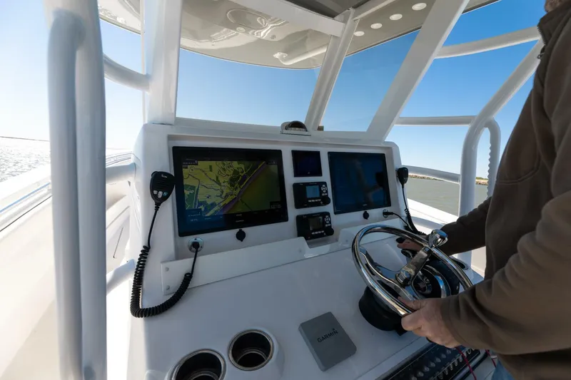 Slide: The Image of 2019 Invincible 39 Open Fisherman helm with navigation screens and steering wheel. - 31