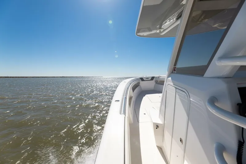 Slide: The Image of 2019 Invincible 39 Open Fisherman boat cruising on sunny waters. - 32