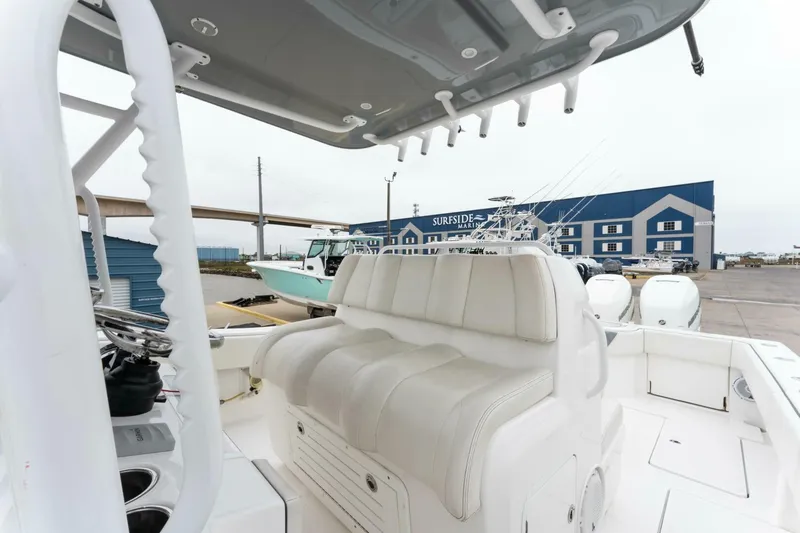 Slide: The Image of 2019 Invincible 39 Open Fisherman boat with cushioned seating and fishing rod holders. - 4