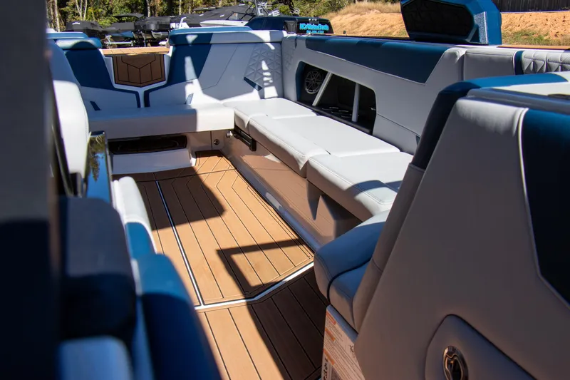 Slide: The Image of 2026 Nautique Super Air Nautique GS24 interior with luxurious seating and sleek design. - 11