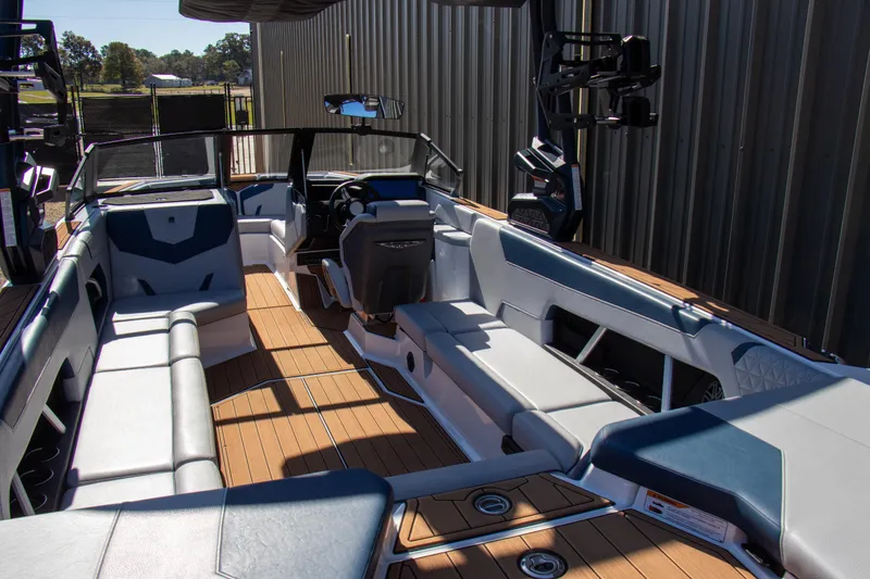 Slide: The Image of 2026 Nautique Super Air Nautique GS24 interior with sleek seating and modern design. - 16