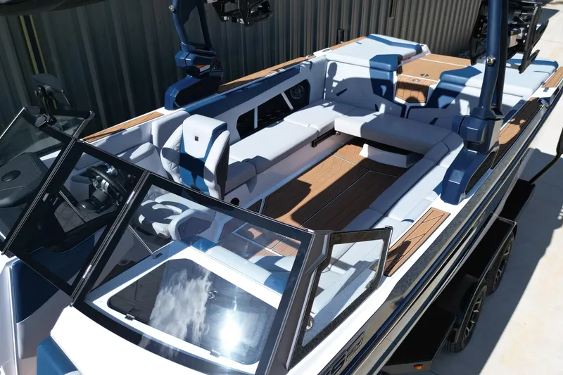 Slide: The Image of 2026 Nautique Super Air Nautique GS24 boat interior with sleek seating and modern design. - 17