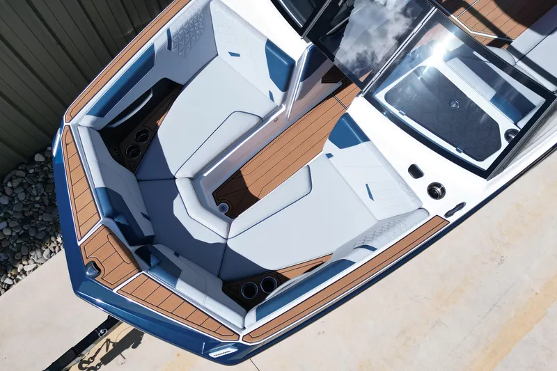 Slide: The Image of 2026 Nautique Super Air Nautique GS24 boat interior with sleek seating and modern design. - 18