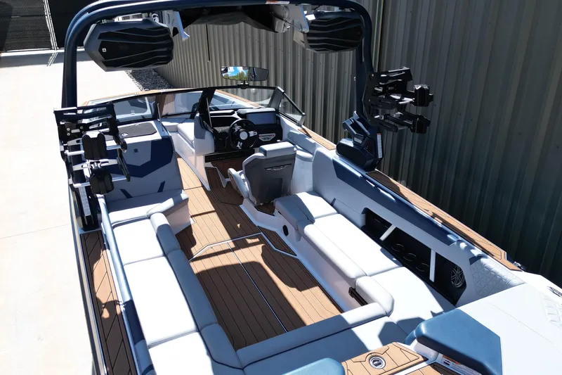 Slide: The Image of 2026 Nautique Super Air Nautique GS24 boat interior with sleek seating and modern design. - 19
