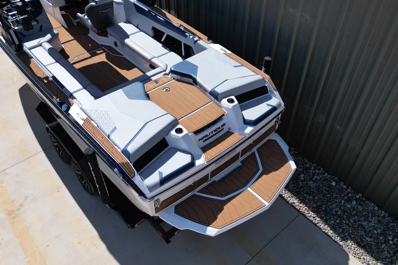 Slide: The Image of 2026 Nautique Super Air Nautique GS24 boat with sleek design and spacious deck. - 20
