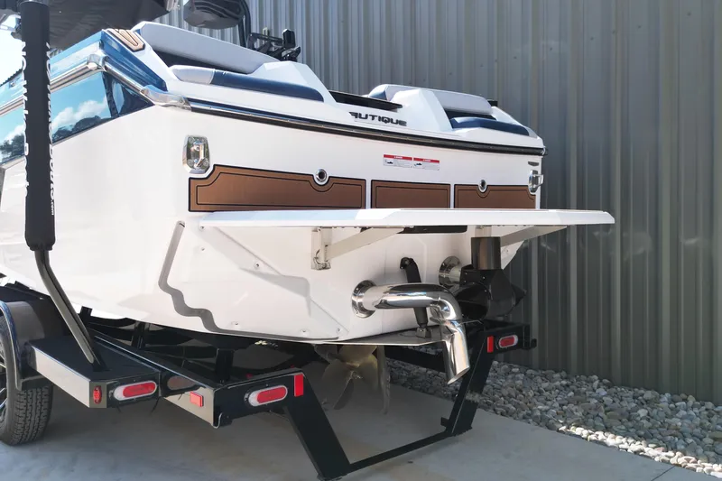 Slide: The Image of 2026 Nautique Super Air Nautique GS24 boat rear view on trailer. - 21