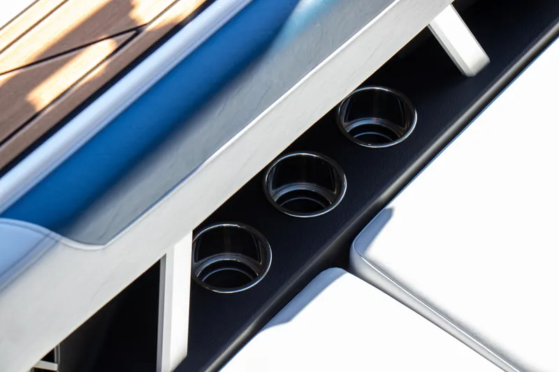 Slide: The Image of 2026 Nautique Super Air Nautique GS24 boat cup holders and seating detail. - 8