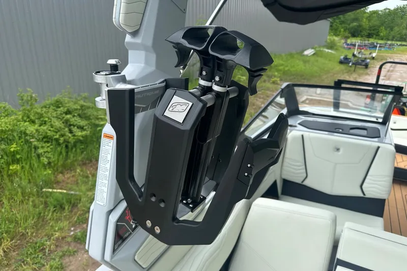 Slide: The Image of 2025 Nautique Super Air Nautique G23 boat interior with advanced wakeboard rack. - 24