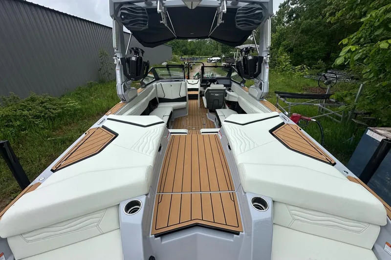 Slide: The Image of 2025 Nautique Super Air Nautique G23 boat interior with sleek seating and modern design. - 28