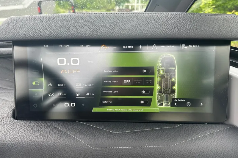 Slide: The Image of 2025 Nautique Super Air Nautique G23 dashboard display with control settings and indicators. - 29