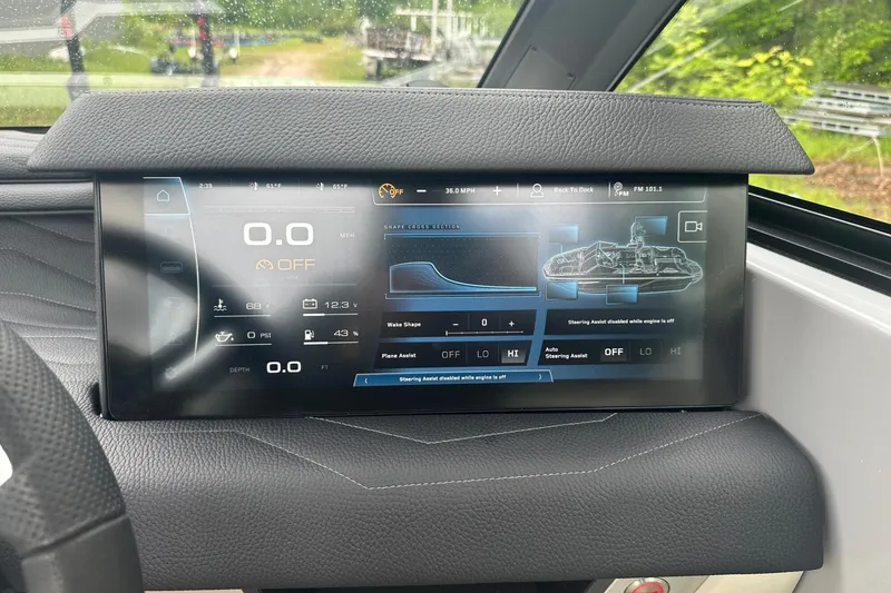 Slide: The Image of 2025 Nautique Super Air Nautique G23 dashboard display with navigation and control features. - 30