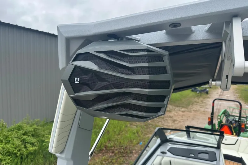 Slide: The Image of 2025 Nautique Super Air Nautique G23 boat speaker, mounted on a sleek frame, outdoors. - 35