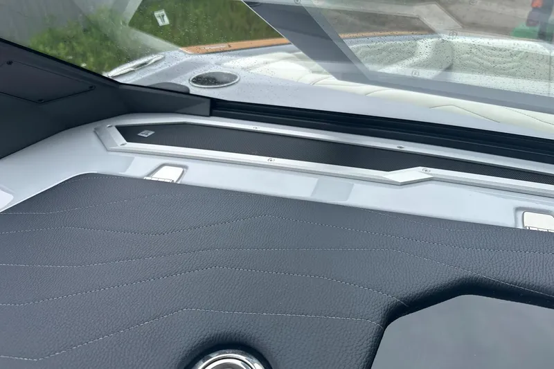 Slide: The Image of Interior view of 2025 Nautique Super Air Nautique G23 boat dashboard. - 36