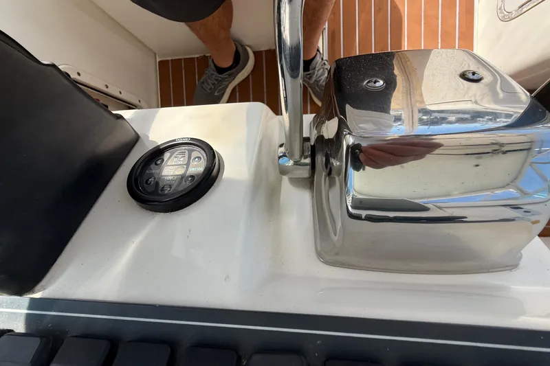 Slide: The Image of Control panel and throttle of a 2002 Rampage 30 Express boat. - 14