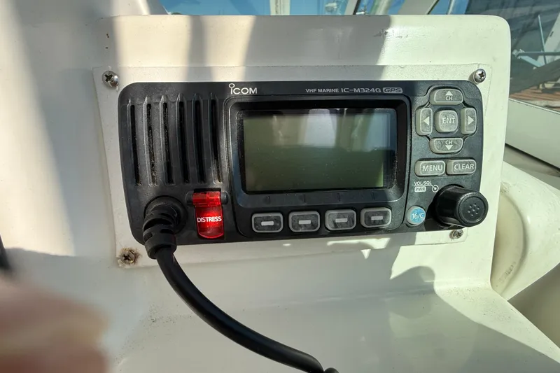 Slide: The Image of VHF marine radio on 2002 Rampage 30 Express boat dashboard. - 15
