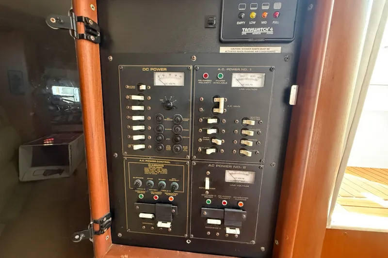 Slide: The Image of Electrical control panel on a 2002 Rampage 30 Express boat. - 27
