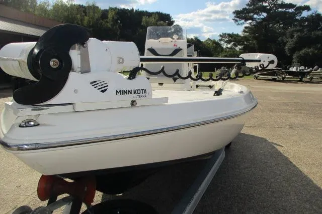 Slide: The Image of 2021 Skeeter SX240 boat with Minn Kota trolling motor on a trailer. - 1