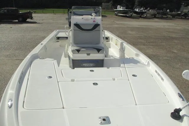 Slide: The Image of 2021 Skeeter SX240 boat with spacious deck and seating, ideal for fishing and leisure. - 10