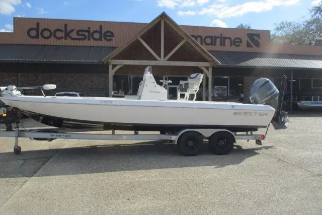 Slide: The Image of 2021 Skeeter SX240 boat on trailer outside Dockside Marine dealership. - 12