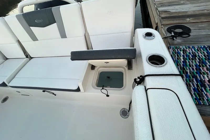 Slide: The Image of 2020 Robalo R230 Center Console boat interior with seating and storage compartments. - 5