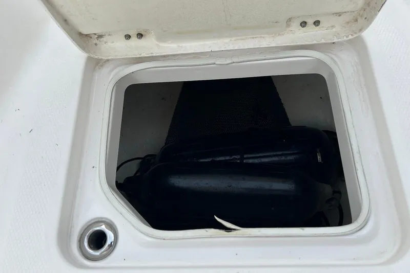 Slide: The Image of Open storage compartment on 2020 Robalo R230 Center Console boat. - 6
