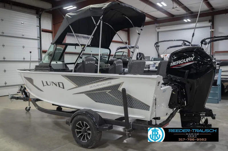 Slide: The Image of 2026 Lund 1675 Adventure Sport boat with Mercury engine in showroom. - 10
