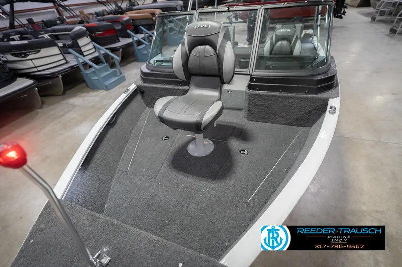 Slide: The Image of 2026 Lund 1675 Adventure Sport boat interior with seating, displayed at Reeder Trausch Marine. - 12