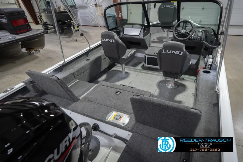 Slide: The Image of 2026 Lund 1675 Adventure Sport boat interior with seating and steering console. - 14
