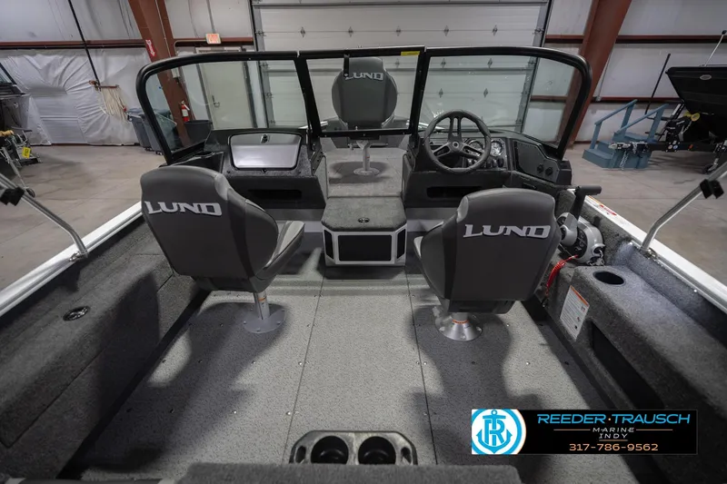 Slide: The Image of 2026 Lund 1675 Adventure Sport boat interior with dual seats and steering console. - 16