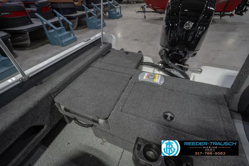 Slide: The Image of 2026 Lund 1675 Adventure Sport boat interior with motor and seating area. - 23