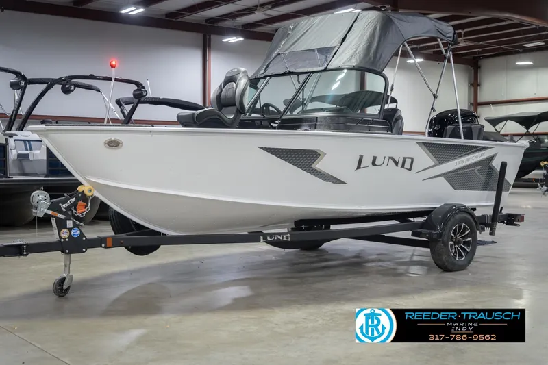 Slide: The Image of 2026 Lund 1675 Adventure Sport boat on trailer in showroom setting. - 4