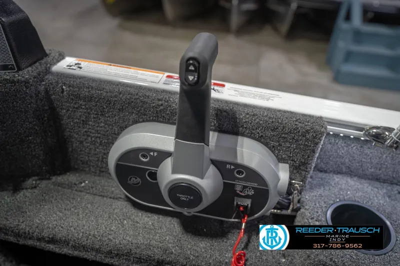 Slide: The Image of 2026 Lund 1675 Adventure Sport boat throttle control with safety lanyard, Reeder-Trausch Marine logo. - 40