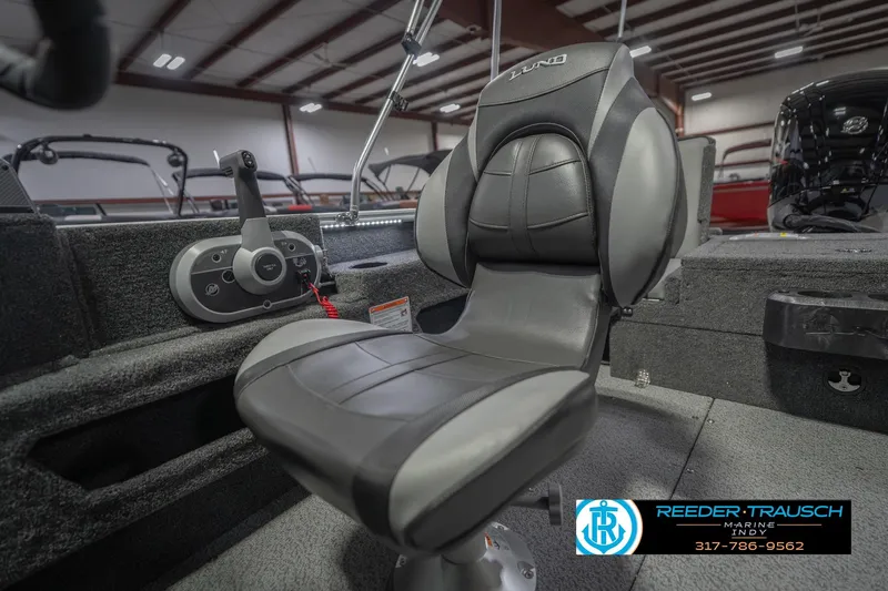 Slide: The Image of 2026 Lund 1675 Adventure Sport boat interior with steering console and seat. - 41