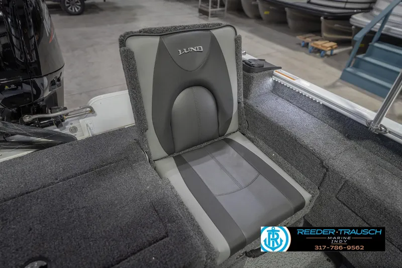 Slide: The Image of 2026 Lund 1675 Adventure Sport boat seat with gray upholstery in showroom. - 43