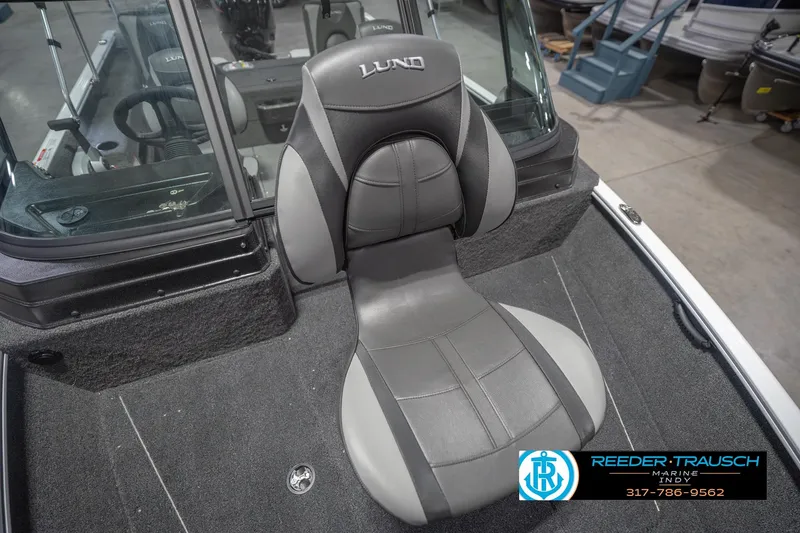 Slide: The Image of 2026 Lund 1675 Adventure Sport boat seat, gray upholstery, Reeder Trausch Marine logo visible. - 45