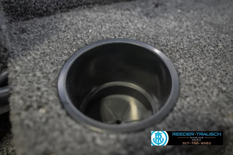 Slide: The Image of Cup holder in 2026 Lund 1675 Adventure Sport boat, featuring carpeted interior. - 46